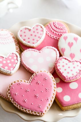 Heart shaped cookies with pink and white icing